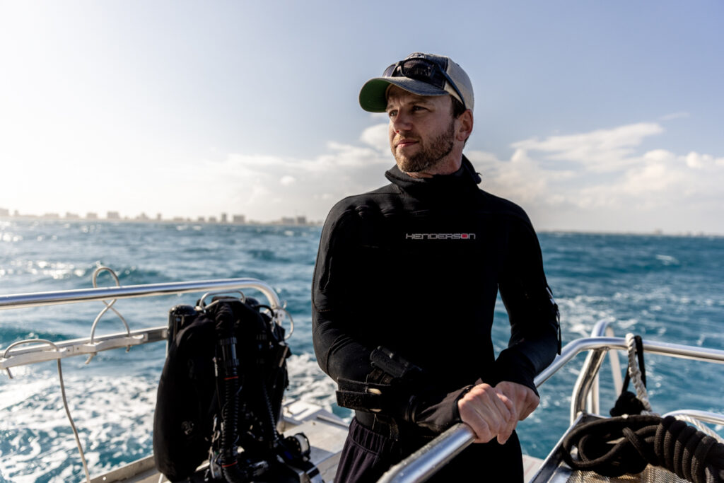 Diver, Jimmy Gadomski, relaxes while waiting to begin his second dive in search of lionfish aboard dive boat, “Goliath,” off Pompano Beach, Florida.